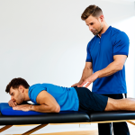 **Prompt:** "A professional male physical therapist, fully clothed in modest athletic wear, demonstrating proper posture while giving a massage to a fully clothed athlete on a massage table in a brightly lit clinic, emphasizing proper technique, safe for work, appropriate content, perfect anatomy, correct proportions, natural pose, well-formed hands, proper finger count, natural body proportions, high quality"
